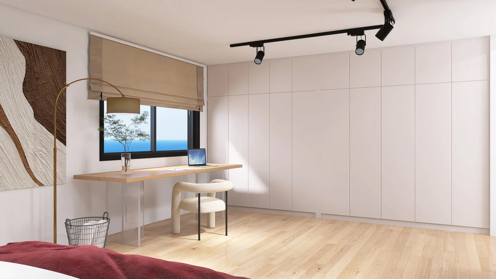 Bedroom wall of white handleless wardrobes running floor to ceiling